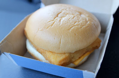 A picture of a fish sandwich in a cardboard box
