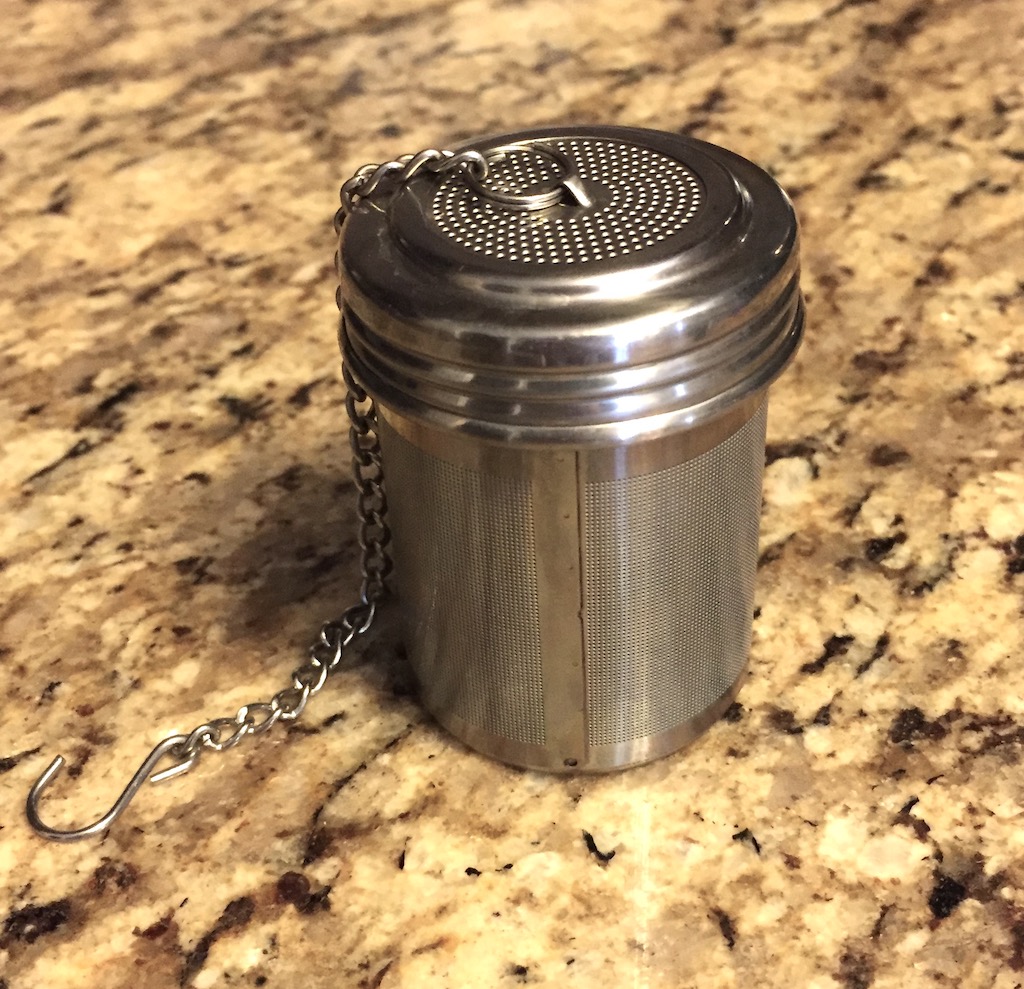 A picture of a resuable stainless steel tea strainer