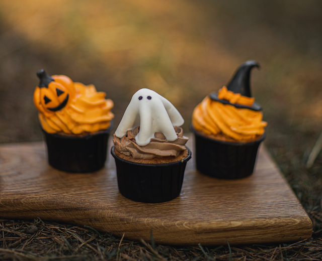 A picture of three Halloween cupcakes, made with leftover Halloween candy