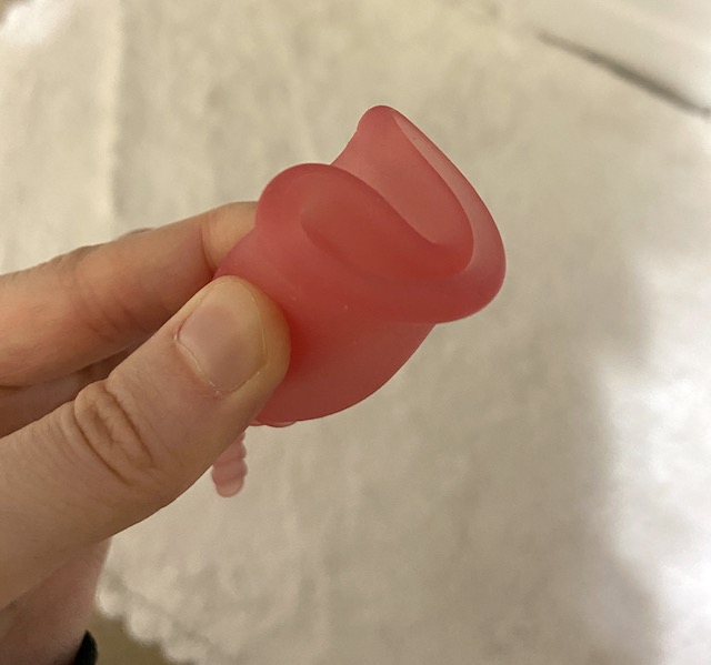 A menstrual cup in the C-fold