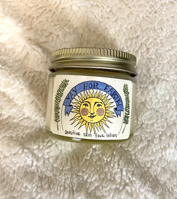A picture of the 2 oz glass jar of Yay for Earth sensitive skin face lotion