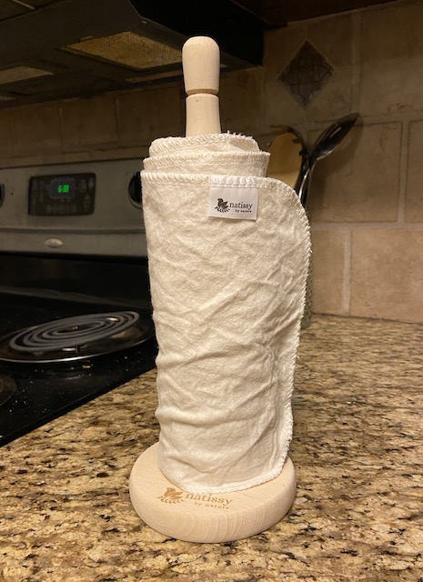 A picture of a roll of Natissy reusable paper towels sitting on the kitchen counter
