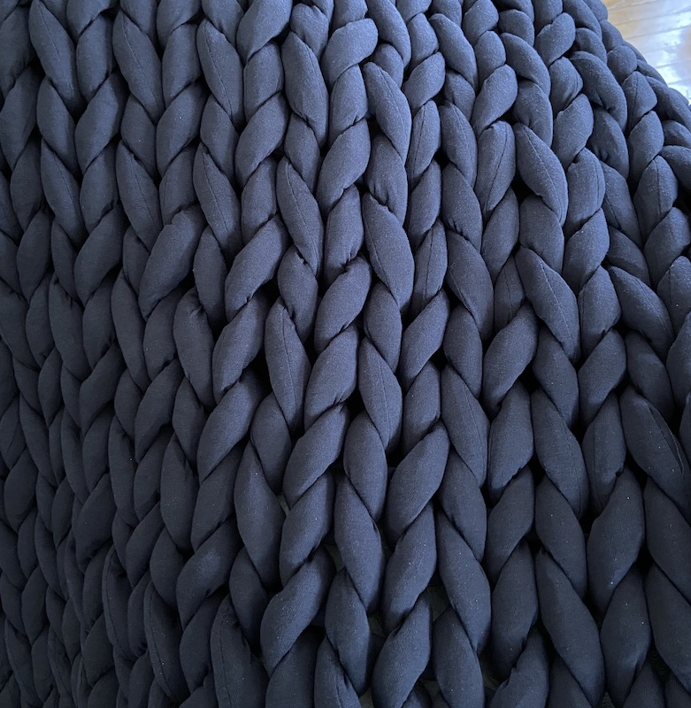 A close up of the weighted yarn in the Nuzzie knit weighted blanket